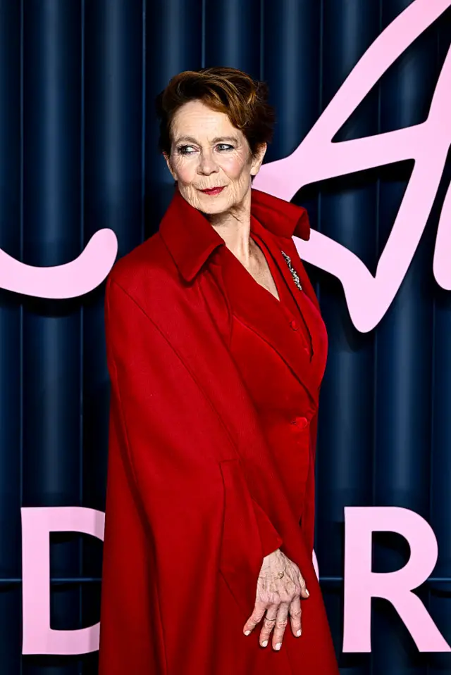 Ceilia Imrie poses in a red cape