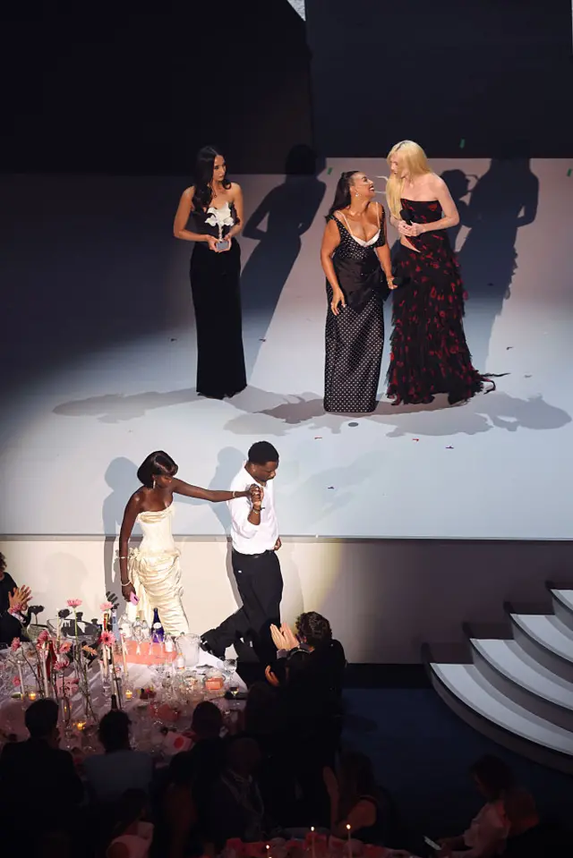 Paloma Elsesser and Alex Consani present The Model Of The Year Award to Anok Yai on stage during The Fashion Awards