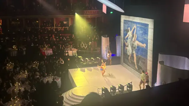 Ballet dancers perform on stage during fashion awards