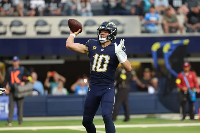 Justin Herbert throws the ball