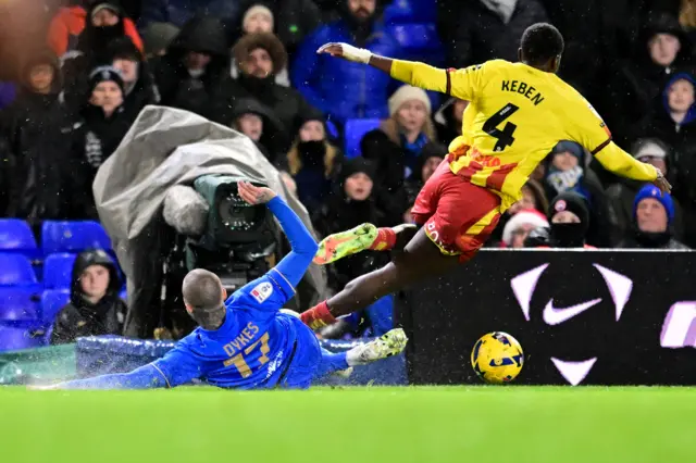 Birmingham City forward Lyndon Dykes (17) tackles Watford defender Kevin Keben (4)