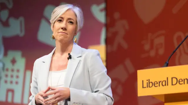 Daisy Cooper speaking at a Lib Dems conference