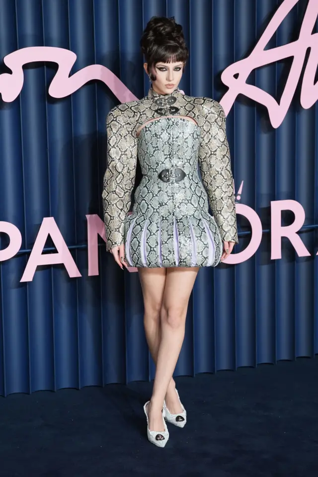 Stylist Charlotte Roberts wears a Jacobean-style skirt with snake-skin print.