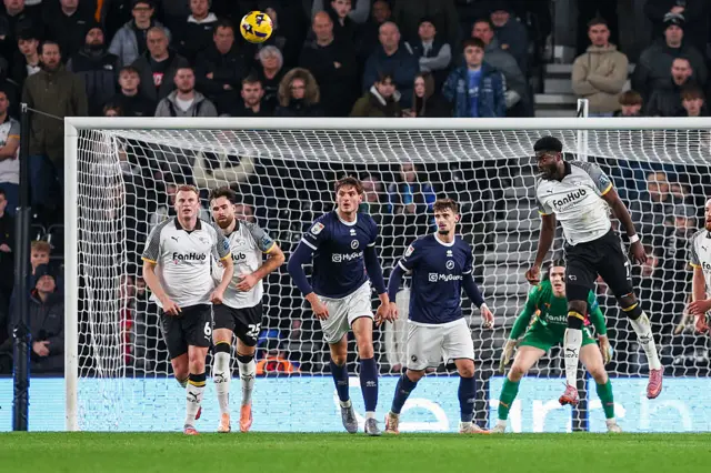 Patrick Agyemang of Derby County heads the ball away