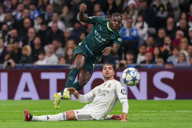Jeremy Doku shoots past Real Madrid's Spanish defender #35 Raul Asencio