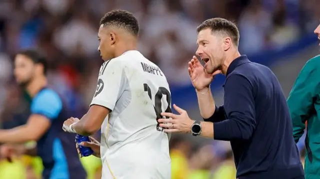 Kylian Mbappé of Real Madrid C.F. and head coach Xabi Alonso of Real Madrid C.F.