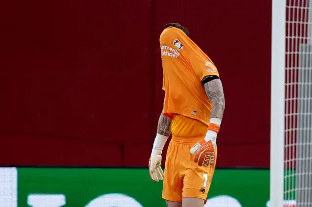 Mark Flekken of Bayer 04 Leverkusen disappointed