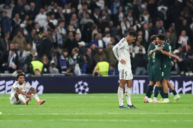 Jude Bellingham looks dejected as Man City celebrate