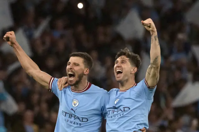 John Stones and Ruben Dias celebrate beating Real MAdrid in CHampions League semi final