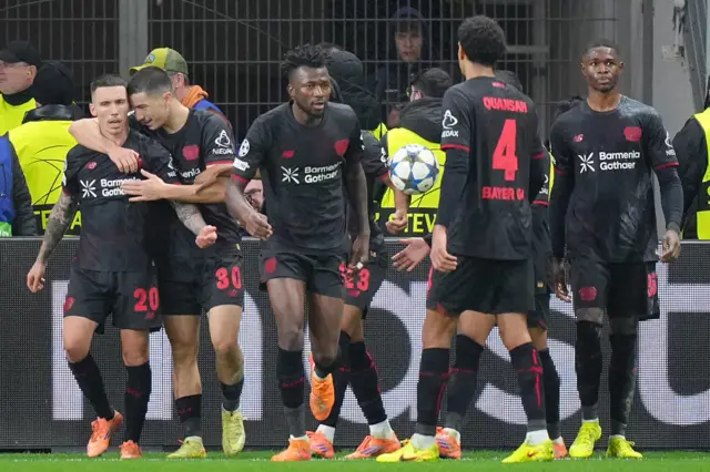 Alejandro Grimaldo (L) celebrates with his team mates