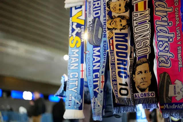 A detailed view of Real Madrid scarves, one featuring Xabi Alonso