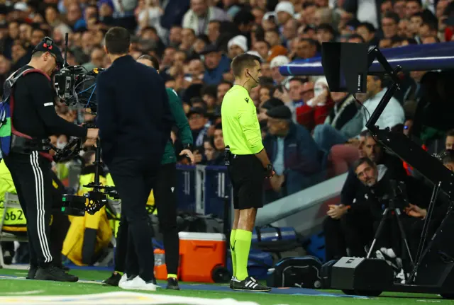 Referee Clement Turpin refers to VAR
