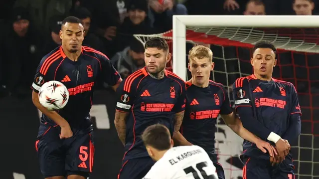 Nottingham Forest's Murillo, Nottingham Forest's Morato, Nottingham Forest's Zach Abbott and Nottingham Forest's Dan Ndoye in the wall as FC Utrecht's Souffian El Karouani shoots at goal from a free kick