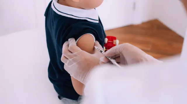 A child gets a flu vaccine