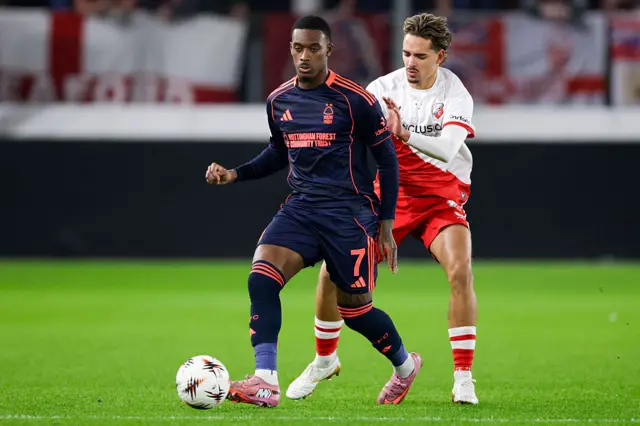 Callum Hudson-Odoi of Notthingham Forest FC battles for the ball with Siebe Horemans of FC Utrecht during the UEFA Europa League 2025/26 League Phase MD6 match between FC Utrecht and Nottingham Forest FC at Stadion Galgenwaard on December 11, 2025 in Utrecht, Netherlands.