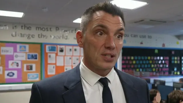 Head teacher Dominic Wilkes in a classroom setting