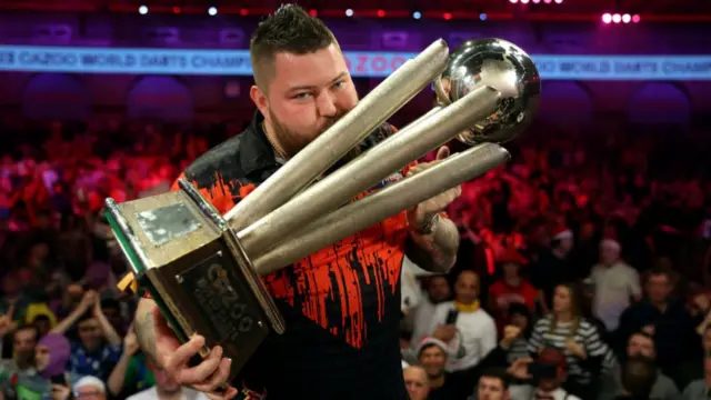 Michael Smith with the World Championship trophy