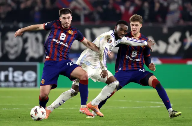 Basel's Leo Leroy in action with Aston Villa's Lamare Bogarde