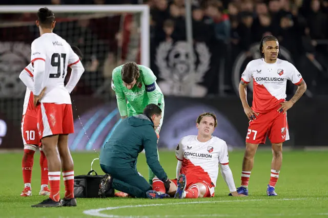 Matisse Didden of FC Utrecht sits injured on the pitch
