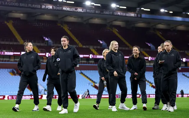 The Aston Villa team inspect the pitch prior to the Barclays Women's Super League match between Aston Villa and Liverpool at Villa Park on December 11, 2025 in Birmingham, England.