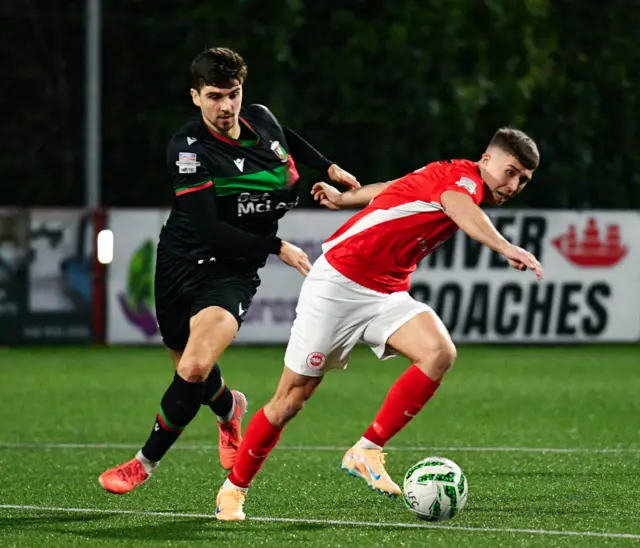 Cammy Palmer tussles for the ball