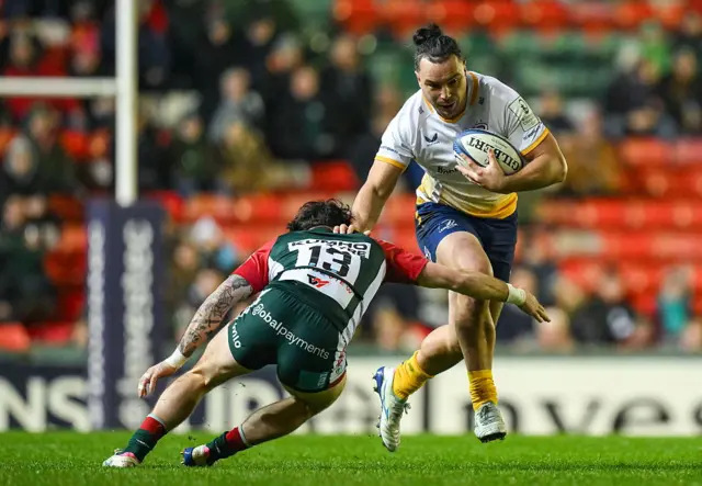 James Lowe of Leinster is tackled by Will Wand