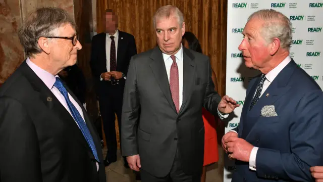 Bill Gates stands and talks to Andrew Mountbatten-Windsor and King Charles at a 2018 summit
