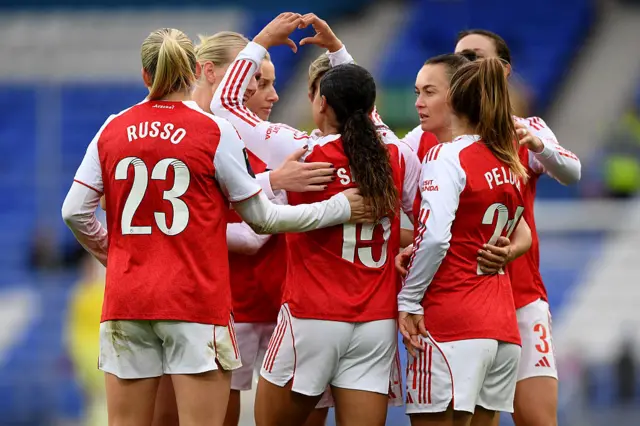 Olivia Smith of Arsenal celebrates scoring her team's third goal with teammates during the Barclays Women's Super League match between Everton and Arsenal at Goodison Park on December 13, 2025 in Liverpool, England.