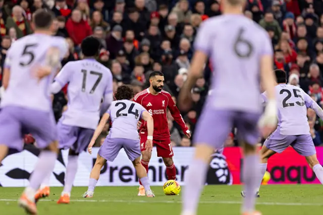 Mohamed Salah of Liverpool faces Ferdi Kadolu and Diego Gómez