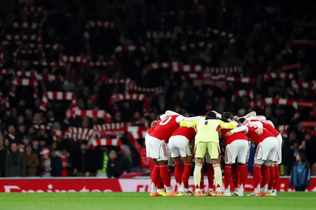 Players of Arsenal form a huddle
