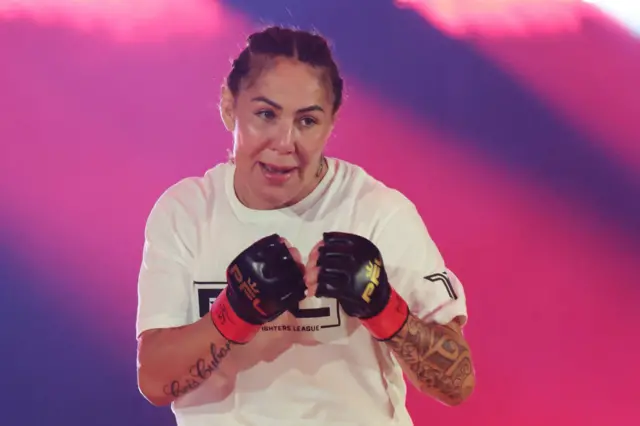 Cris Cyborg with her MMA gloves up