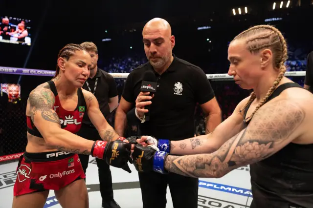 Cris Cyborg and Sara Collins fist bump before a fight