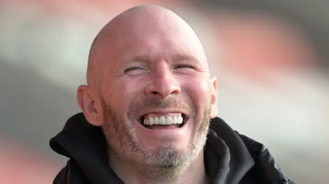 Shrewsbury boss Michael Appleton smiling.