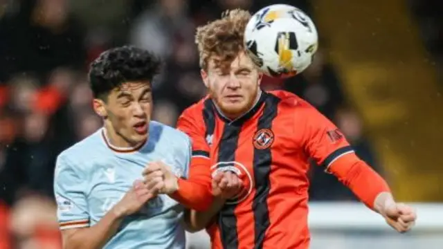 Motherwell's Elijah Just and Dundee United's Luca Stephenson