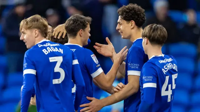 Cardiff celebrate their third goal