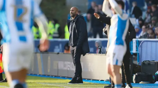 Lee Grant on the touchline