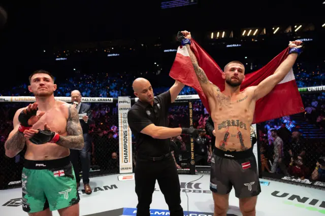 Connor Hughes applauds as ALEX CHIZOV is confirmed the winner