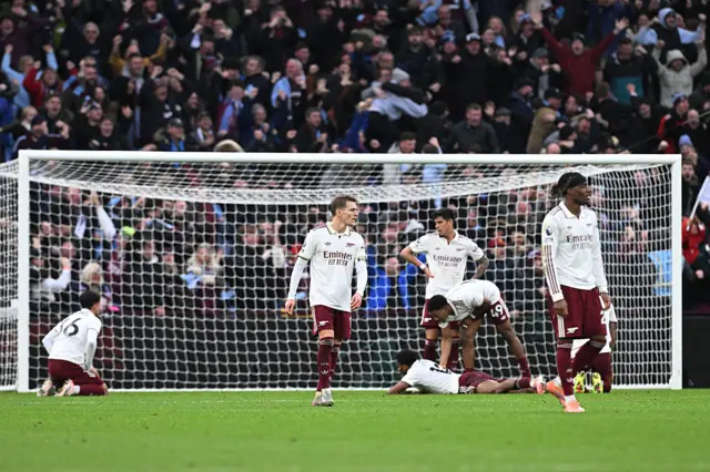 Arsenal players look dejected after Aston Villa loss