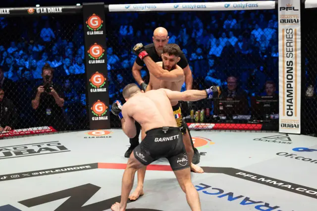 Baris Adiguzel punches Dean Garnett