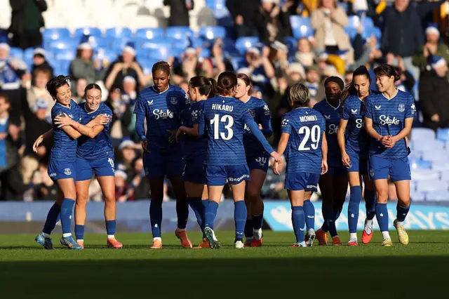 Honoka Hayashi of Everton celebrates scoring her team's first goal with teammates during the Barclays Women's Super League match between Everton and Arsenal at Goodison Park on December 13, 2025 in Liverpool, England.