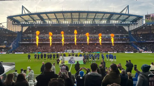 Stamford Bridge stadium with the players lining up