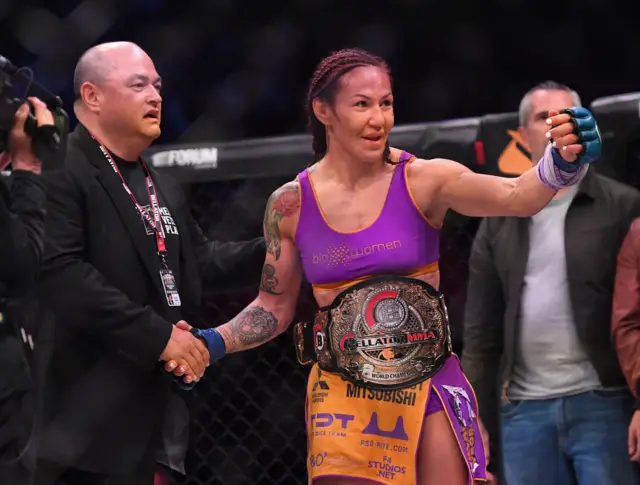 Cris Cyborg with her Bellator world title belt