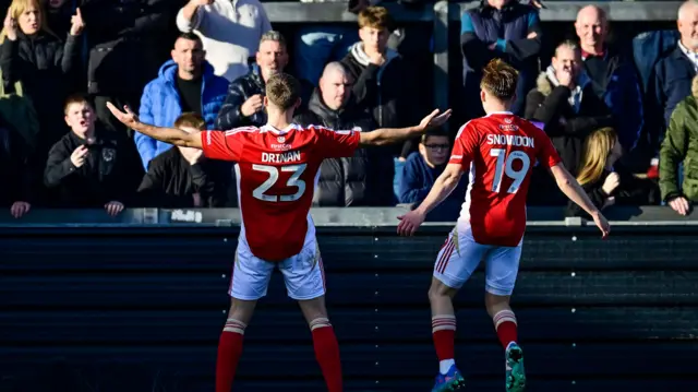 Aaron Drinan celebrates the third Swindon goal