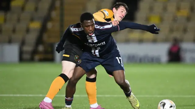 Dundee's Tony Yogane and Livingston's Daniel Finlayson