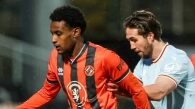 Dundee United's Amar Fatah and Motherwell's Lukas Fadinger