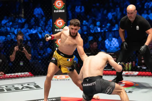 Baris Adiguzel punches Dean Garnett