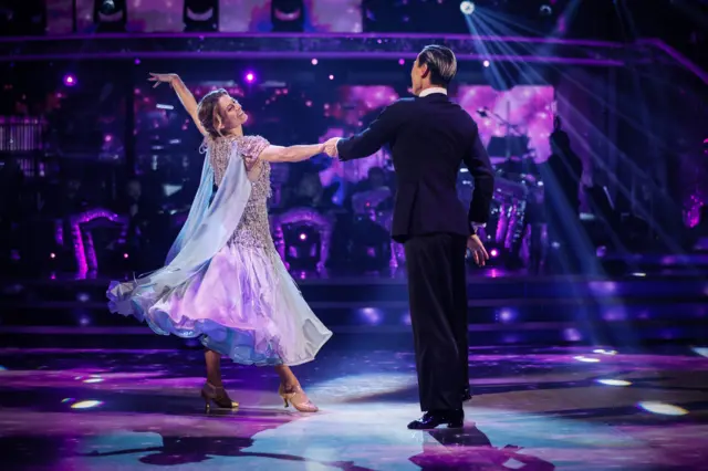 Karen and Carlos dancing Waltz in a light blue dress
