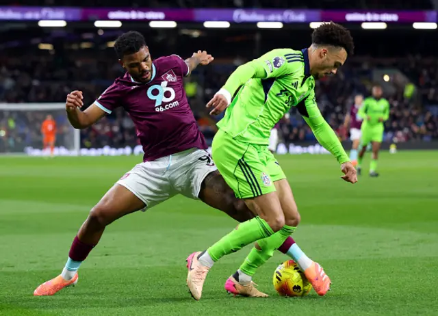 Antonee Robinson of Fulham is challenged by Lyle Foster