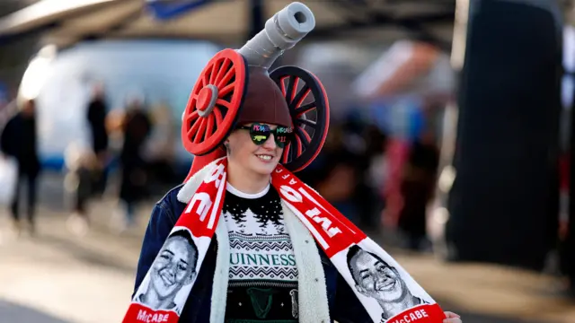 An Arsenal fan outside the stadium before the match.