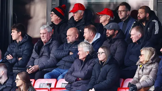 Steve Bruce and Paul Scholes in the stands at Salford